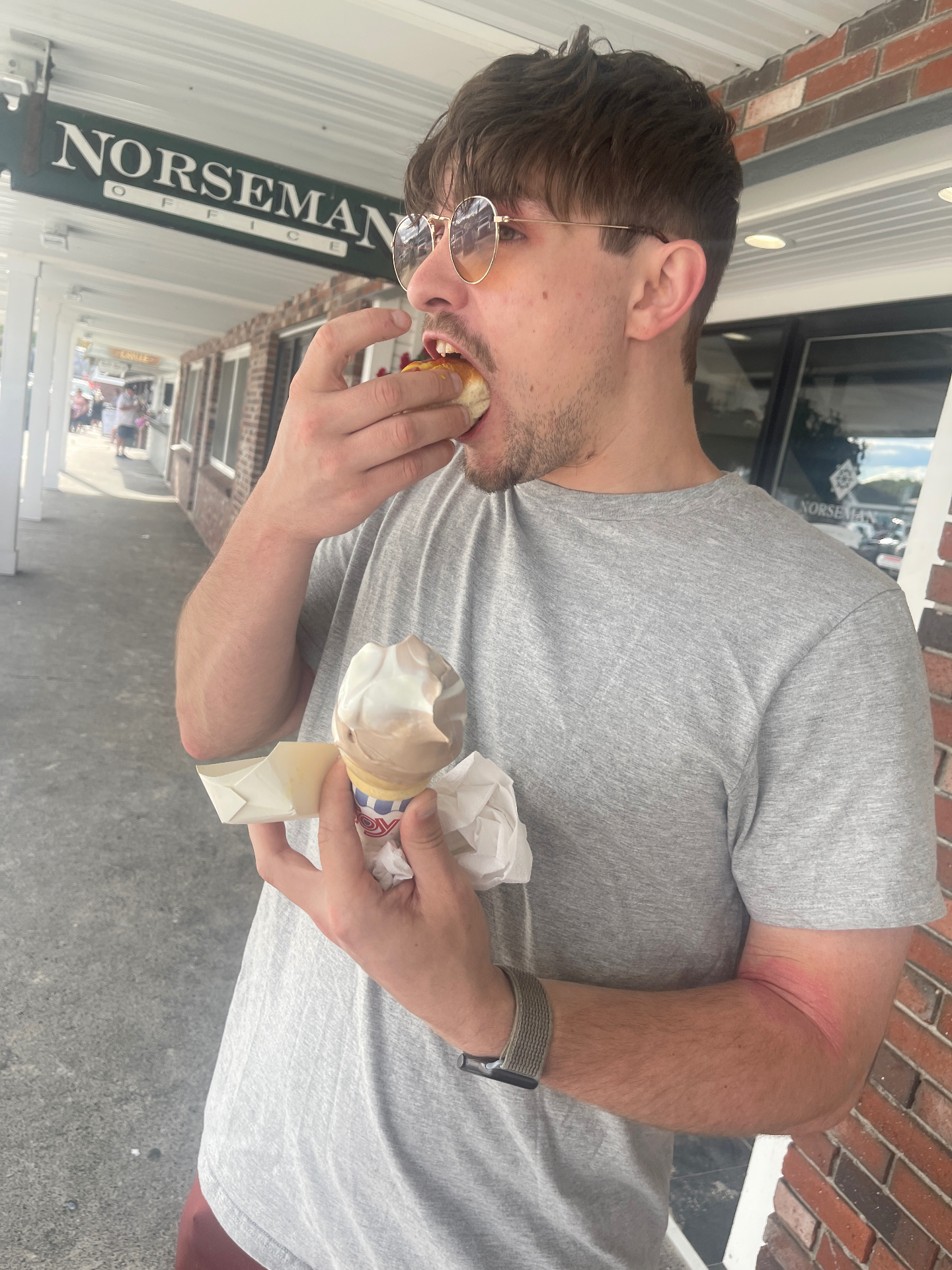 Richie Zahodnick on the Cape May boardwalk holding a hot dog and an ice cream cone